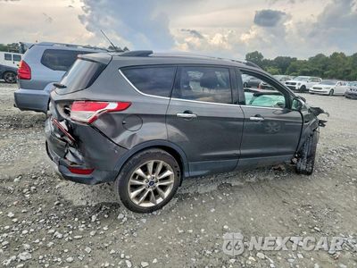 Trzecie zdjęcie samochodu z tyłu: 2016 FORD ESCAPE SE VIN:1FMCU0GX2GUA81117 - miniatura