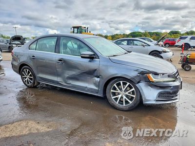 Czwarte zdjęcie samochodu z boku: 2017 VOLKSWAGEN JETTA SE VIN:3VWDB7AJ1HM379026 - miniatura