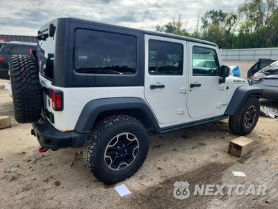 Trzecie zdjęcie samochodu z tyłu: 2016 JEEP WRANGLER UNLIMITED RUBICON VIN:1C4HJWFG1GL169606 - miniatura