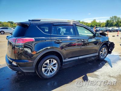 Trzecie zdjęcie samochodu z tyłu: 2018 TOYOTA RAV4 HYBRID XLE VIN:JTMRJREV9JD209843 - miniatura