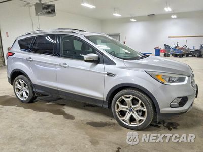 Czwarte zdjęcie samochodu z boku: 2017 FORD ESCAPE TITANIUM VIN:1FMCU9J90HUB77280 - miniatura