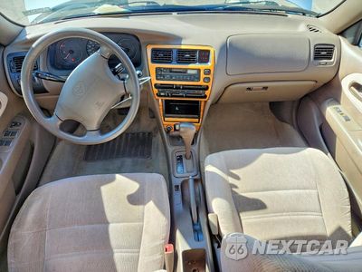 Zdjęcie 8 z 12 samochodu: 1997 TOYOTA COROLLA DX VIN:1NXBB02E9VZ652932 - miniatura