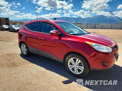 Czwarte zdjęcie samochodu z boku: 2012 HYUNDAI TUCSON GLS VIN:KM8JUCAC4CU500237 - miniatura
