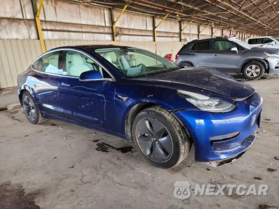 Czwarte zdjęcie samochodu z boku: 2020 TESLA MODEL 3 VIN:5YJ3E1EA3LF591047 - miniatura