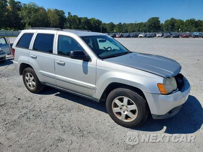 Czwarte zdjęcie samochodu z boku: 2010 JEEP GRAND CHEROKEE LAREDO VIN:1J4PR4GK5AC110670 - miniatura