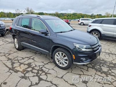 Czwarte zdjęcie samochodu z boku: 2014 VOLKSWAGEN TIGUAN S VIN:WVGBV3AXXEW525008 - miniatura