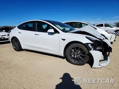 Czwarte zdjęcie samochodu z boku: 2023 TESLA MODEL 3 VIN:5YJ3E1EA9PF612022 - miniatura