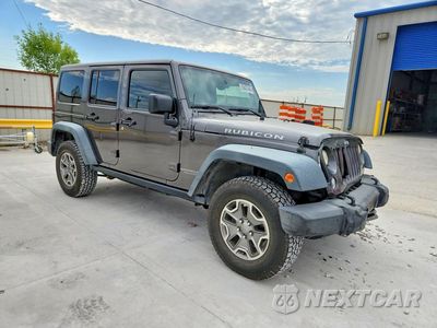 Czwarte zdjęcie samochodu z boku: 2014 JEEP WRANGLER UNLIMITED RUBICON VIN:1C4BJWFG1EL256862 - miniatura