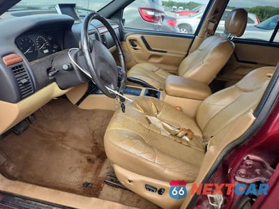 Zdjęcie 7 z 13 samochodu: 1999 JEEP GRAND CHEROKEE LAREDO VIN:1J4GW58S7XC678876 - miniatura