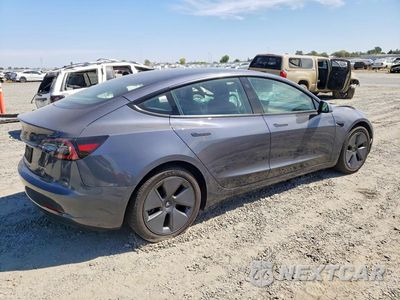 Trzecie zdjęcie samochodu z tyłu: 2023 TESLA MODEL 3 VIN:5YJ3E1EB9PF387531 - miniatura