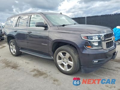 Czwarte zdjęcie samochodu z boku: 2015 CHEVROLET TAHOE C1500 LT VIN:1GNSCBKC1FR178160 - miniatura
