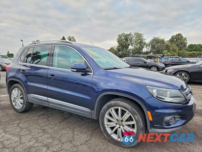 Czwarte zdjęcie samochodu z boku: 2012 VOLKSWAGEN TIGUAN S VIN:WVGAV7AX2CW518117 - miniatura