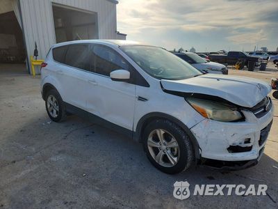 Czwarte zdjęcie samochodu z boku: 2014 FORD ESCAPE SE VIN:1FMCU0GX0EUA50302 - miniatura