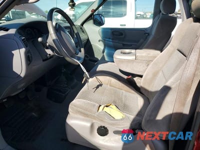 Zdjęcie 7 z 12 samochodu: 2001 FORD F150 VIN:1FTRX18W31NA88984 - miniatura