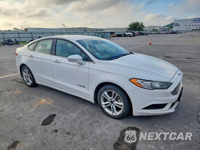 Czwarte zdjęcie samochodu z boku: 2018 FORD FUSION SE HYBRID VIN:3FA6P0LU3JR261165 - miniatura