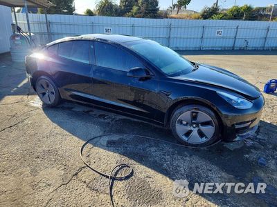 Czwarte zdjęcie samochodu z boku: 2021 TESLA MODEL 3 VIN:5YJ3E1EAXMF929478 - miniatura