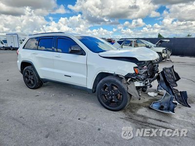 Czwarte zdjęcie samochodu z boku: 2019 JEEP GRAND CHEROKEE LAREDO VIN:1C4RJFAG4KC629328 - miniatura