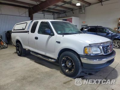 Czwarte zdjęcie samochodu z boku: 2001 FORD F150 VIN:1FTZX17271NA47076 - miniatura