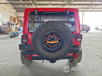 Zdjęcie 6 z 12 samochodu: 2012 JEEP WRANGLER UNLIMITED SAHARA VIN:1C4BJWEGXCL188981 - miniatura