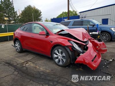 Czwarte zdjęcie samochodu z boku: 2022 TESLA MODEL Y VIN:7SAYGDEE7NF425379 - miniatura