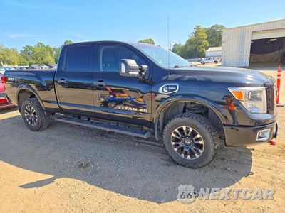 Czwarte zdjęcie samochodu z boku: 2017 NISSAN TITAN XD PRO-4X VIN:1N6BA1F48HN521288 - miniatura