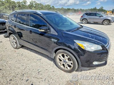 Czwarte zdjęcie samochodu z boku: 2016 FORD ESCAPE TITANIUM VIN:1FMCU0J99GUC91465 - miniatura