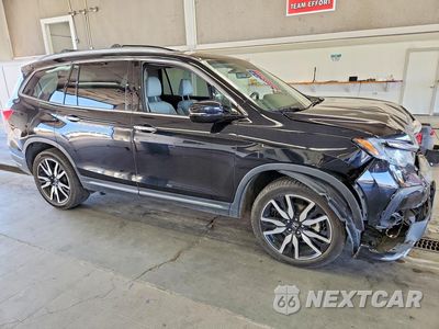 Czwarte zdjęcie samochodu z boku: 2019 HONDA PILOT TOURING VIN:5FNYF6H63KB001158 - miniatura