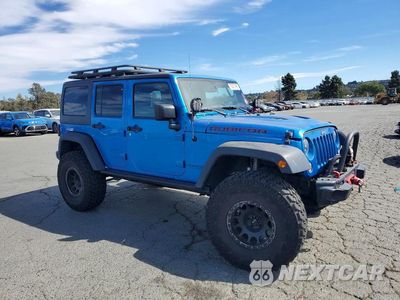 Czwarte zdjęcie samochodu z boku: 2016 JEEP WRANGLER UNLIMITED RUBICON VIN:1C4BJWFG0GL270092 - miniatura