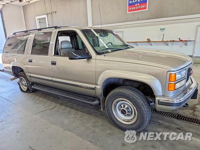 Czwarte zdjęcie samochodu z boku: 1999 GMC SUBURBAN K2500 VIN:3GKGK26J5XG527661 - miniatura