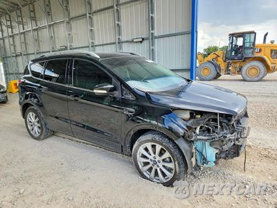 Czwarte zdjęcie samochodu z boku: 2017 FORD ESCAPE TITANIUM VIN:1FMCU0JD3HUB15209 - miniatura