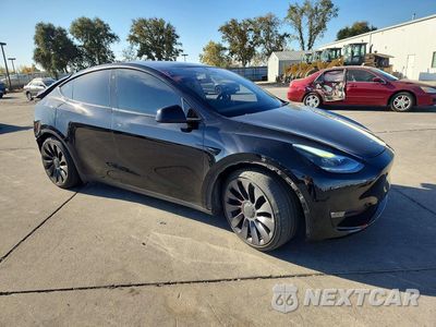 Czwarte zdjęcie samochodu z boku: 2022 TESLA MODEL Y VIN:7SAYGDEF9NF311764 - miniatura