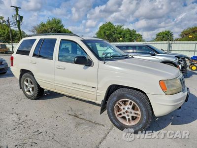 Czwarte zdjęcie samochodu z boku: 2002 JEEP GRAND CHEROKEE LIMITED VIN:1J8GW58J22C272597 - miniatura