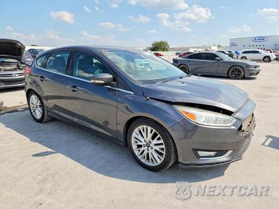 Czwarte zdjęcie samochodu z boku: 2017 FORD FOCUS TITANIUM VIN:1FADP3N26HL349219 - miniatura