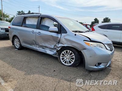 Czwarte zdjęcie samochodu z boku: 2014 TOYOTA SIENNA XLE 8-PASSENGER VIN:5TDYK3DC7ES433502 - miniatura