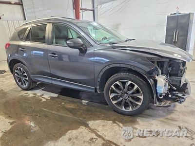 Czwarte zdjęcie samochodu z boku: 2016 MAZDA CX-5 GT VIN:JM3KE4DY8G0898771 - miniatura