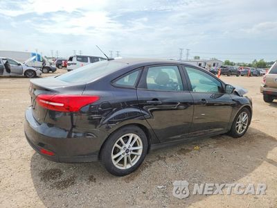 Trzecie zdjęcie samochodu z tyłu: 2017 FORD FOCUS SE VIN:1FADP3F20HL339414 - miniatura