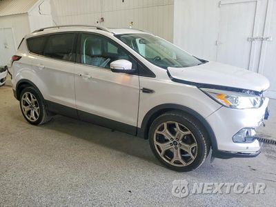 Czwarte zdjęcie samochodu z boku: 2017 FORD ESCAPE TITANIUM VIN:1FMCU9J97HUC38155 - miniatura