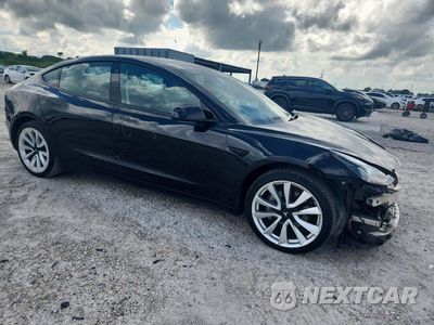 Czwarte zdjęcie samochodu z boku: 2022 TESLA MODEL 3 VIN:5YJ3E1EB0NF186016 - miniatura