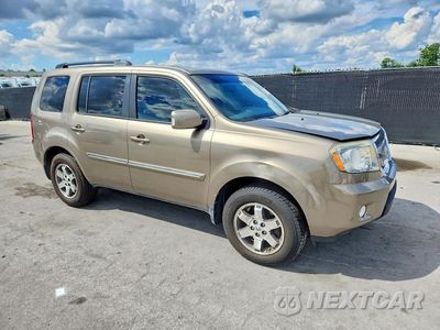 Czwarte zdjęcie samochodu z boku: 2011 HONDA PILOT TOURING VIN:5FNYF3H9XBB043058 - miniatura