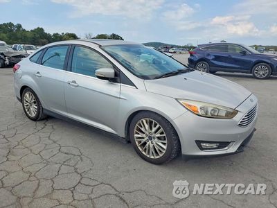 Czwarte zdjęcie samochodu z boku: 2017 FORD FOCUS TITANIUM VIN:1FADP3J21HL280011 - miniatura