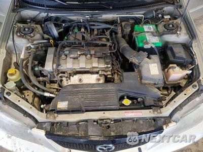 Zdjęcie 11 z 12 samochodu: 2003 MAZDA PROTEGE DX VIN:JM1BJ225731209907 - miniatura