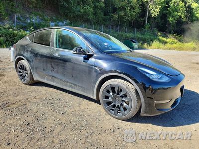 Czwarte zdjęcie samochodu z boku: 2023 TESLA MODEL Y VIN:7SAYGDEE3PF613397 - miniatura