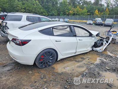Trzecie zdjęcie samochodu z tyłu: 2022 TESLA MODEL 3 VIN:5YJ3E1EC0NF110479 - miniatura