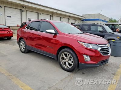 Czwarte zdjęcie samochodu z boku: 2018 CHEVROLET EQUINOX PREMIER VIN:3GNAXMEV0JS500236 - miniatura