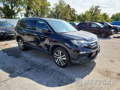 Czwarte zdjęcie samochodu z boku: 2017 HONDA PILOT TOURING VIN:5FNYF6H95HB022385 - miniatura