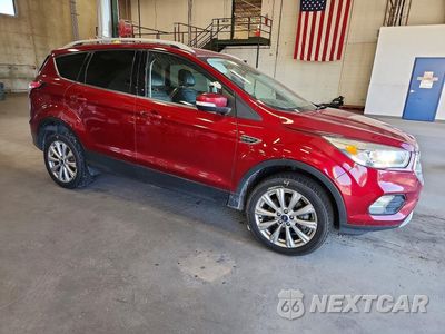 Czwarte zdjęcie samochodu z boku: 2017 FORD ESCAPE TITANIUM VIN:1FMCU9J9XHUD52814 - miniatura