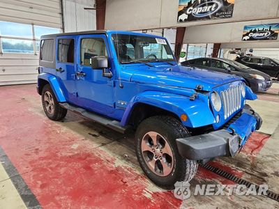 Czwarte zdjęcie samochodu z boku: 2016 JEEP WRANGLER UNLIMITED SAHARA VIN:1C4BJWEG9GL230773 - miniatura