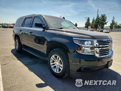 Czwarte zdjęcie samochodu z boku: 2015 CHEVROLET TAHOE C1500 LT VIN:1GNSCBKC7FR684883 - miniatura