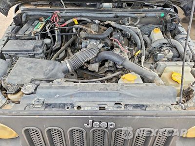 Zdjęcie 12 z 13 samochodu: 2010 JEEP WRANGLER UNLIMITED SAHARA VIN:1J4HA5H13AL198349 - miniatura