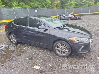 Czwarte zdjęcie samochodu z boku: 2018 HYUNDAI ELANTRA VALUE EDITION VIN:5NPD84LF0JH399370 - miniatura